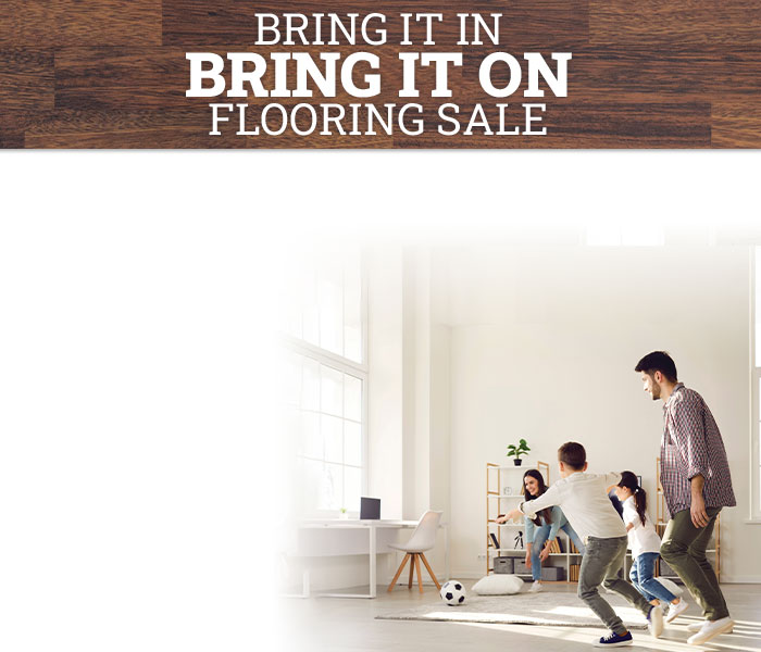 Kids playing in rain boots on luxury vinyl flooring.